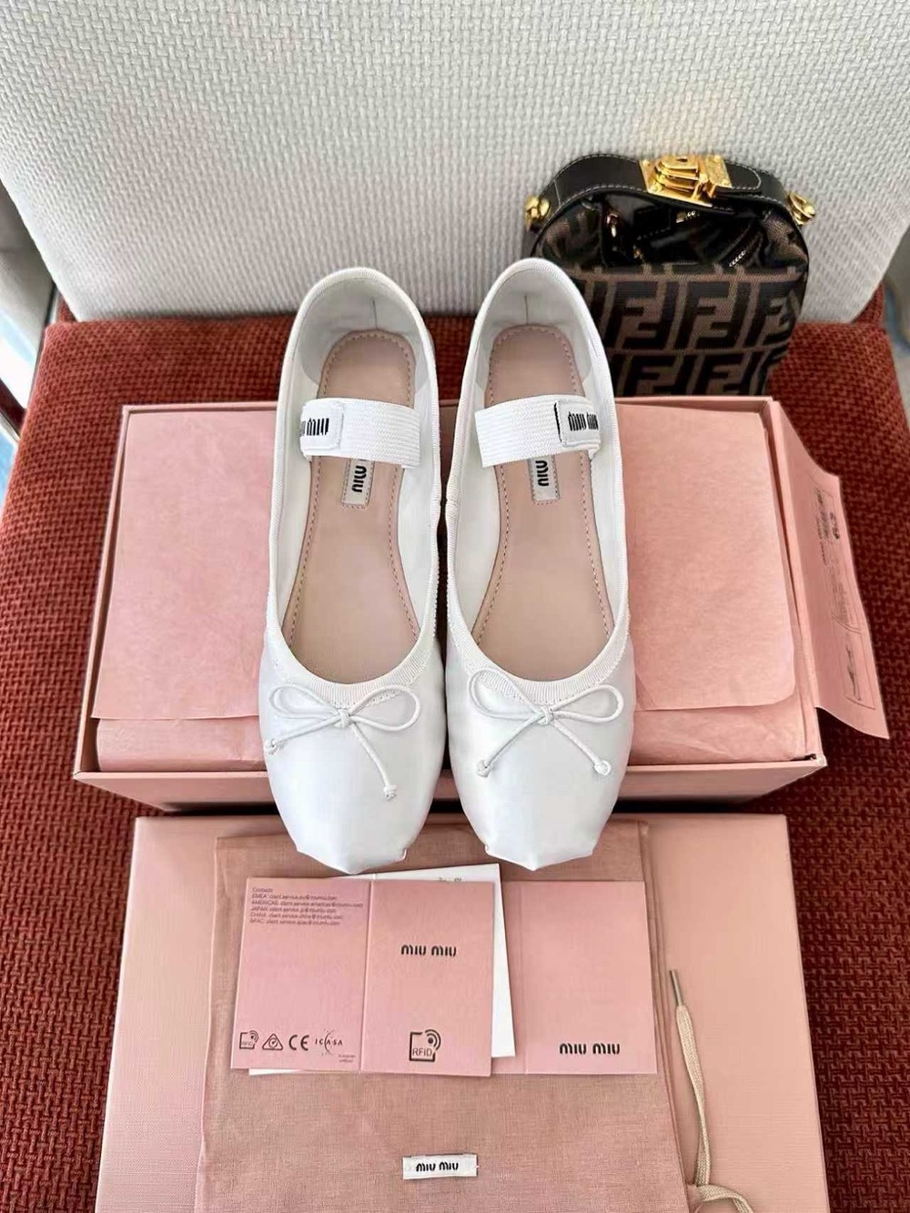 Miu Miu White Leather Ballet Flats with Elastic Strap and Bow